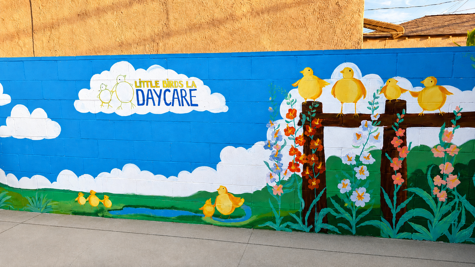 Hand-painted bird mural on the backyard wall